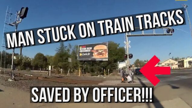 Heroic-Officer-saves-man-from-railroad-tracks-whose-wheelchair-was-stuck-on-the-tracks